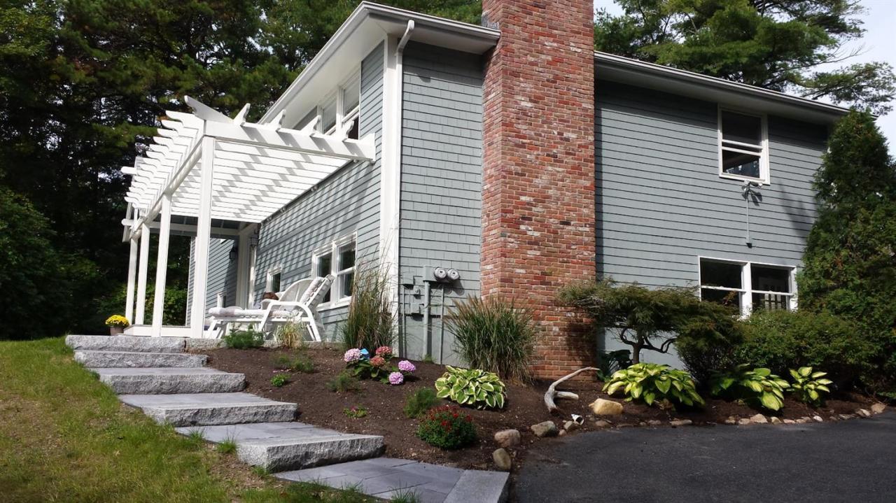 56 Elgin Road Pocasset, MA 02559 - Photo 5 of 35 a view of a house with yard and sitting area