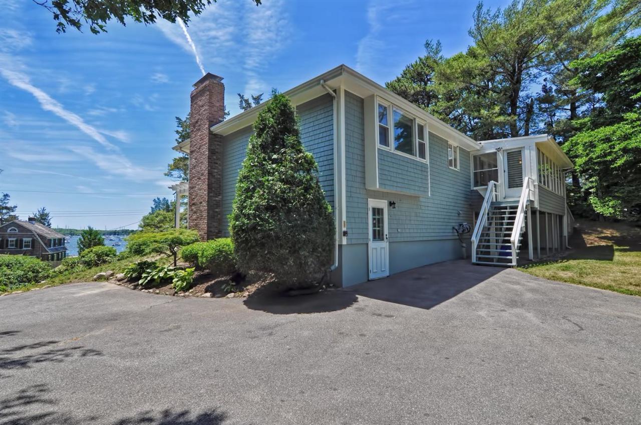 56 Elgin Road Pocasset, MA 02559 - Photo 6 of 35 front view of a house with a yard