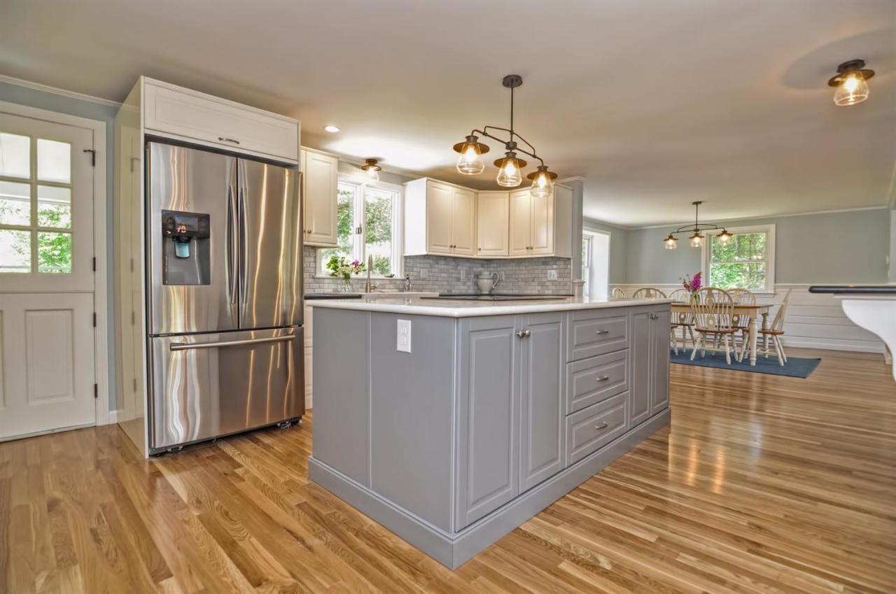 56 Elgin Road Pocasset, MA 02559 - Photo 10 of 35 a kitchen with stainless steel appliances a refrigerator sink and wooden floor