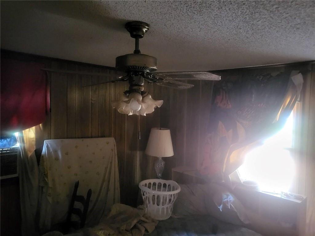 546 Alton Lawson Road Adrian, GA 31002 - Photo 29 of 29 a lamp that has a vase of flowers on it