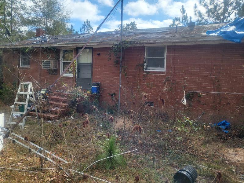 546 Alton Lawson Road Adrian, GA 31002 - Photo 7 of 29 a front view of a house with plants
