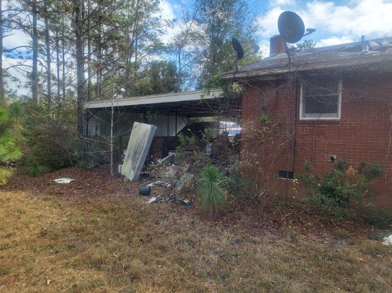 546 Alton Lawson Road Adrian, GA 31002 - Photo 9 of 29 a front view of a house with garden