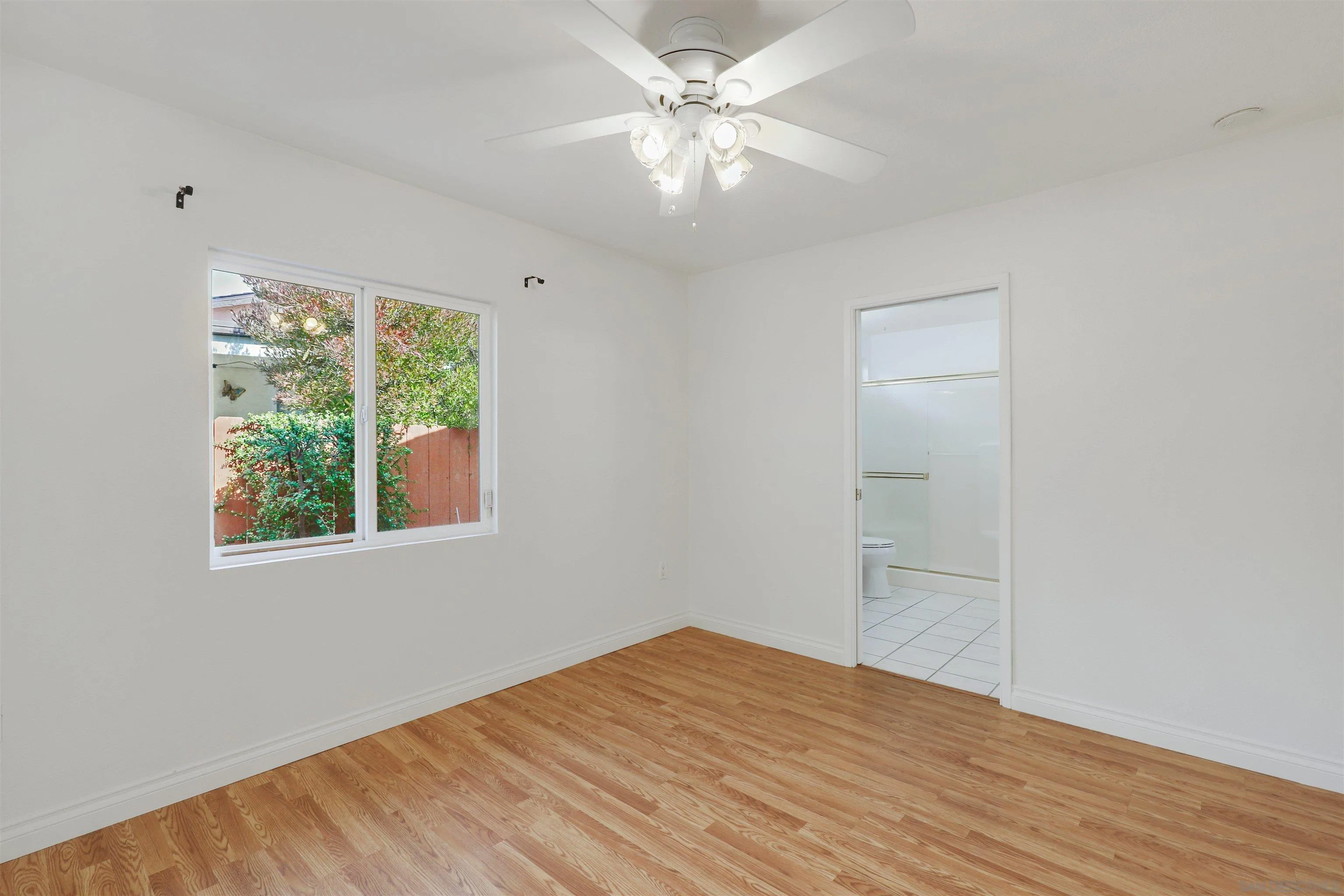 4716 Sunrise Ridge Oceanside, CA 92056 - Photo 17 of 31 wooden floor in an empty room with a window