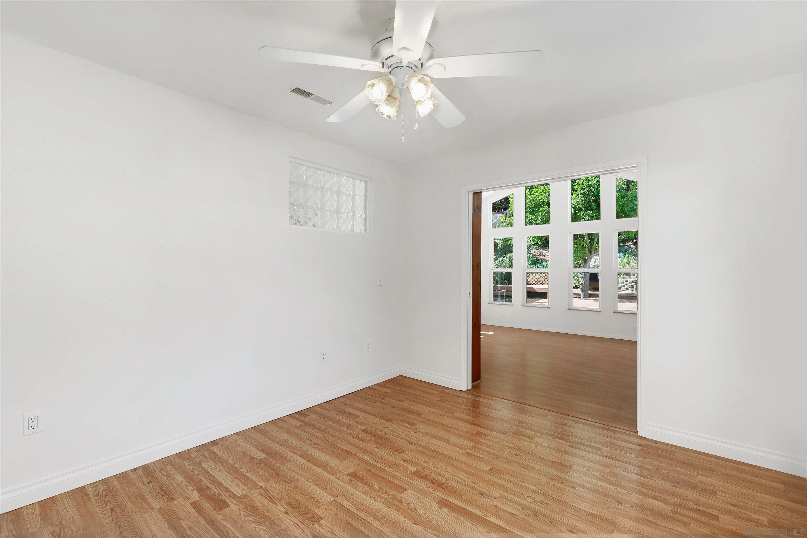 4716 Sunrise Ridge Oceanside, CA 92056 - Photo 19 of 31 wooden floor in an empty room with a window