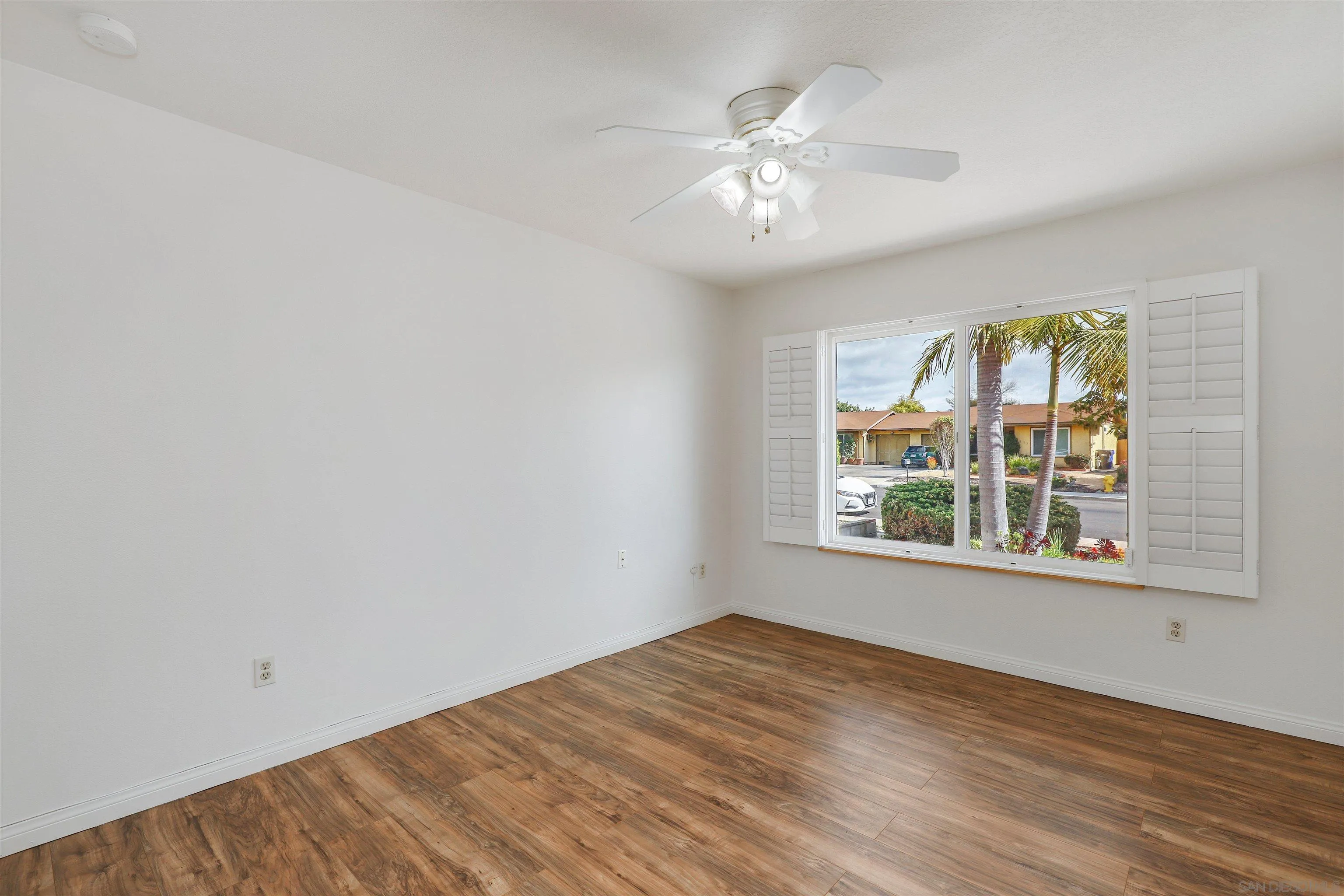 4716 Sunrise Ridge Oceanside, CA 92056 - Photo 21 of 31 wooden floor in an empty room with a window