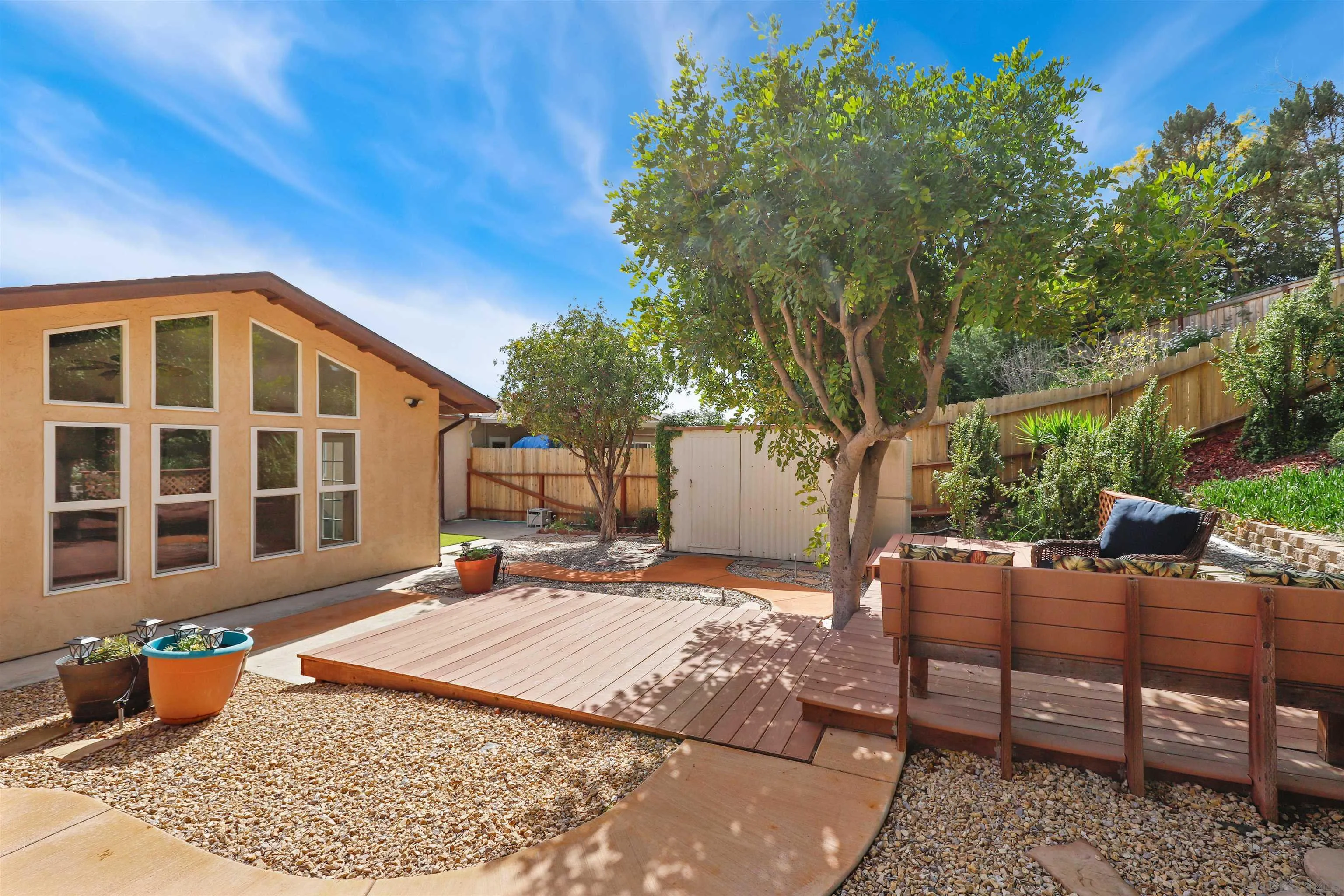 4716 Sunrise Ridge Oceanside, CA 92056 - Photo 30 of 31 a backyard of a house with barbeque oven table and chairs