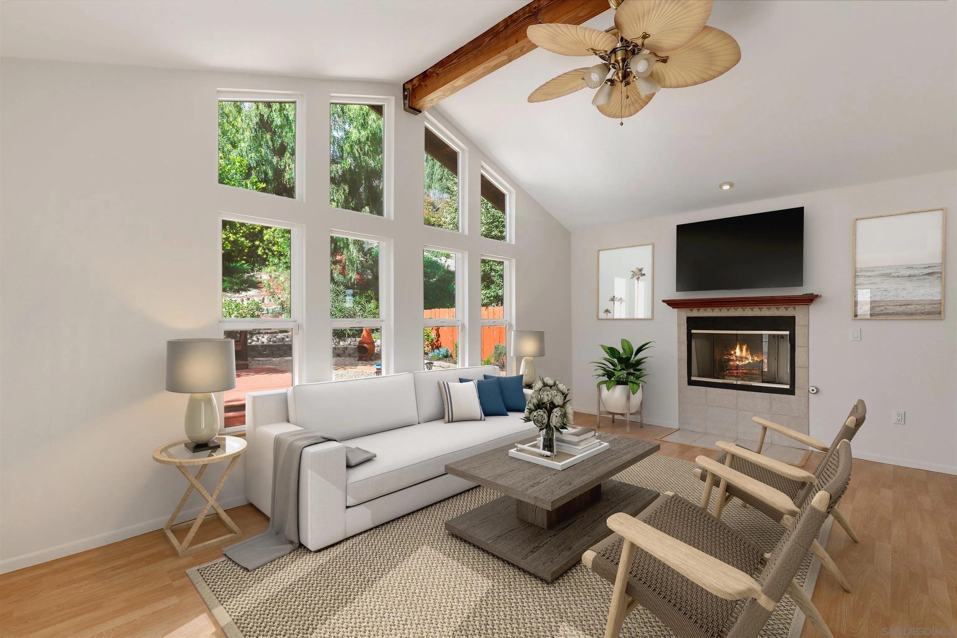 4716 Sunrise Ridge Oceanside, CA 92056 - Photo 10 of 31 a living room with furniture a flat screen tv and a large window