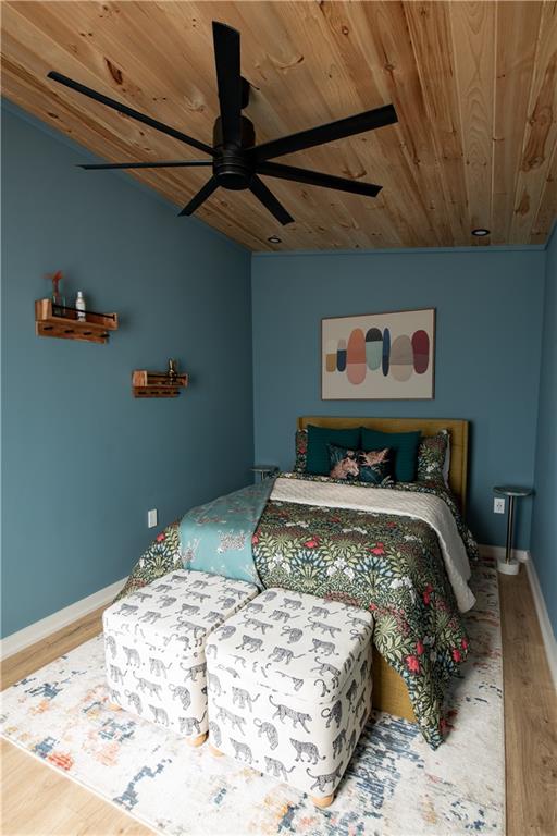 71 Geyser Court Ranger, GA 30734 - Photo 32 of 57 a bedroom with a bed and a chandelier