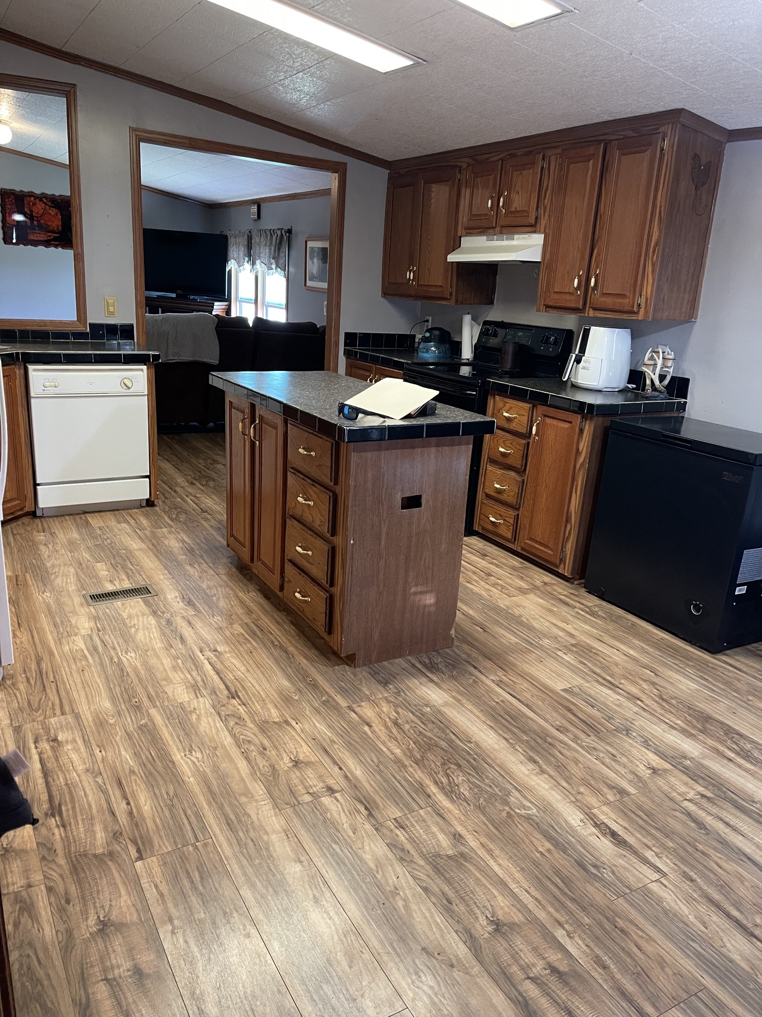 2779 Highland Road Lafayette, TN 37083 - Photo 13 of 13 a kitchen with stainless steel appliances granite countertop a stove a sink and a microwave