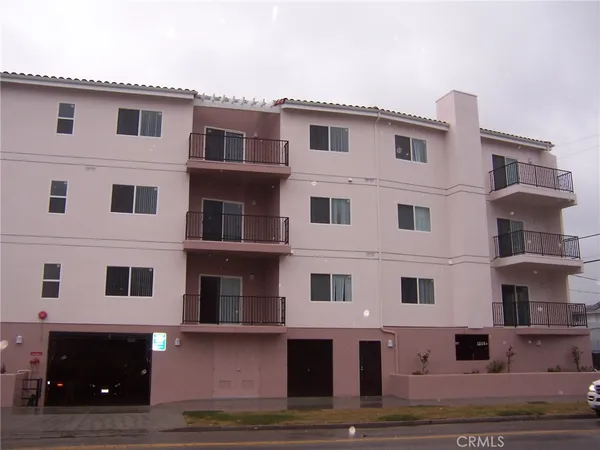 a front view of a building with many windows