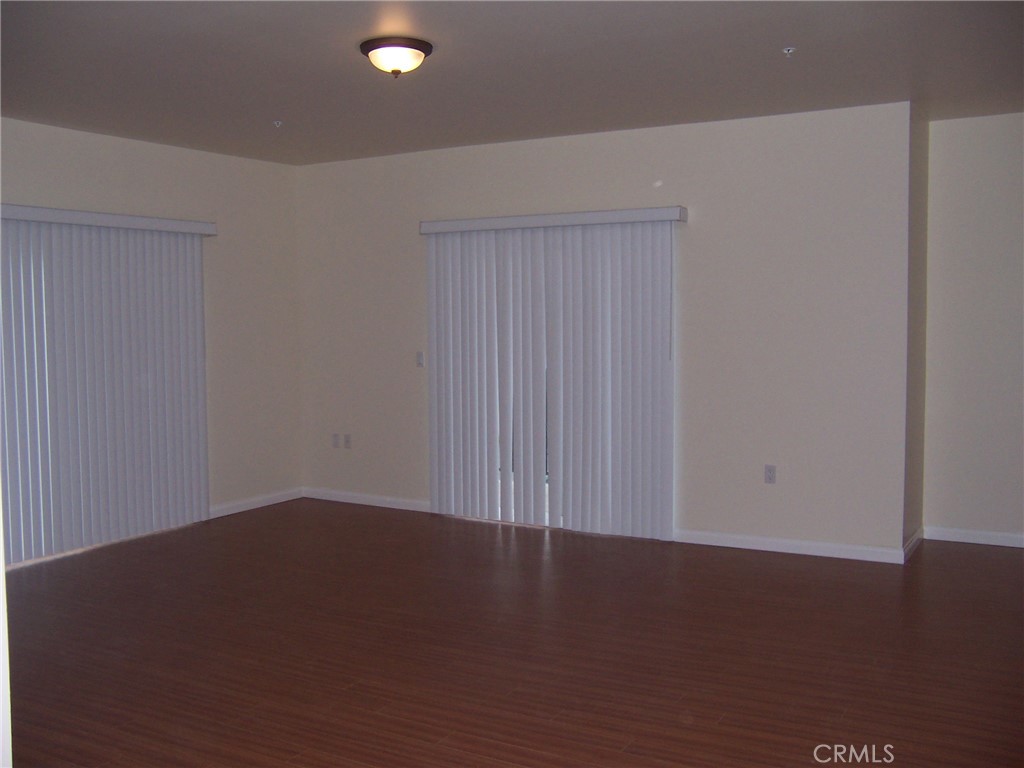 4438 Vista Del Monte Avenue, Unit 202 Sherman Oaks, CA 91403 - Photo 2 of 11 an empty room with wooden floor