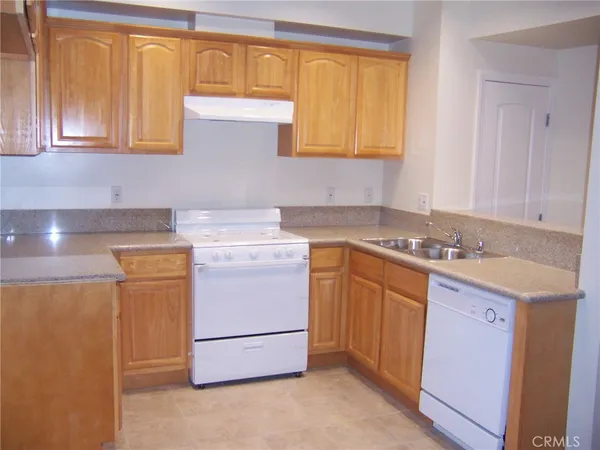 a utility room with a sink washer and dryer