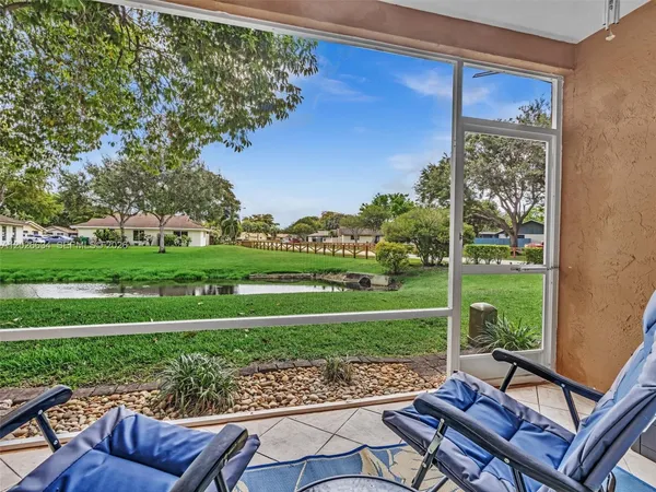 a view of a patio with a yard