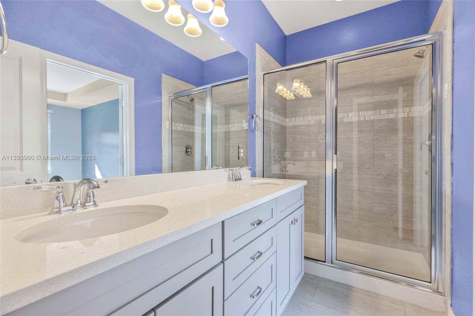 Hillcrest Hollywood, FL 33021 - Photo 12 of 30 a bathroom with a shower sink and mirror