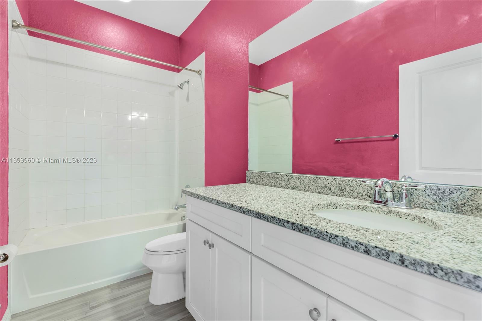 Hillcrest Hollywood, FL 33021 - Photo 17 of 30 a bathroom with a granite countertop sink a toilet and shower