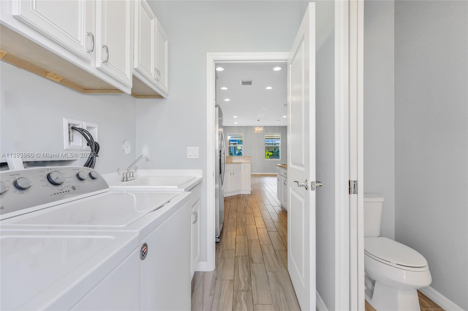 Hillcrest Hollywood, FL 33021 - Photo 8 of 30 a bathroom with a sink and mirror with toilet