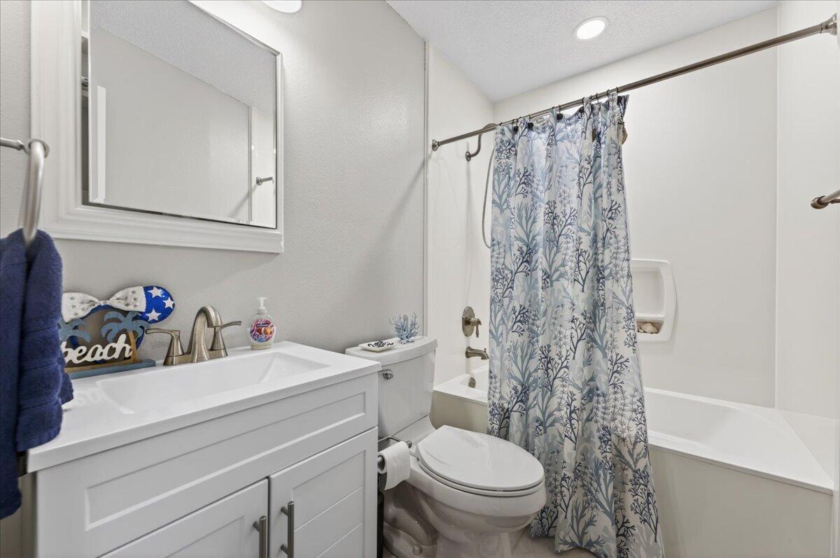210 Shell Drive Crestview, FL 32536 - Photo 37 of 67 a bathroom with a sink a toilet and a shower curtain