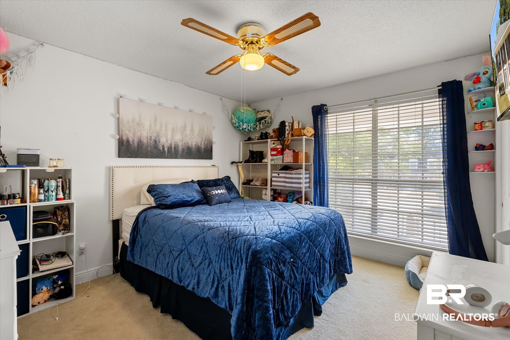 7432 Johnson Court Mobile, AL 36695 - Photo 24 of 30 Carpeted bedroom with a textured ceiling and ceiling fan