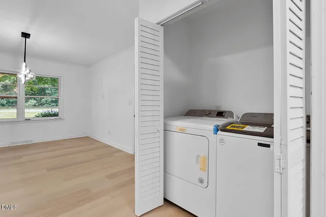a bathroom with a sink mirror and toilet