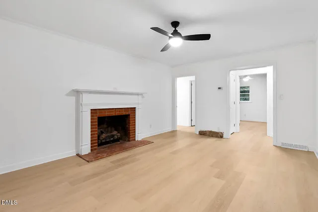 a view of an empty room with windows