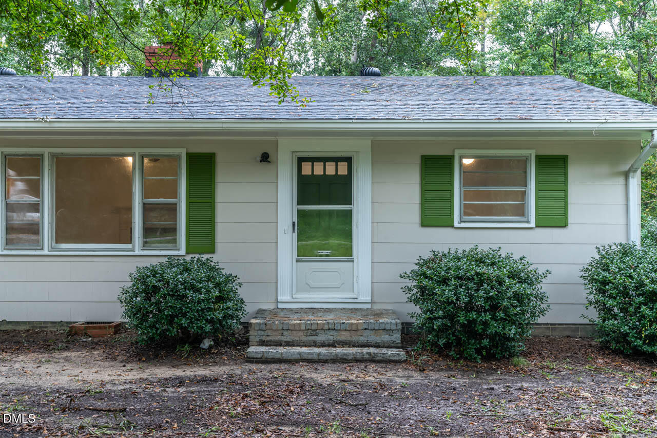 3508 Old US 1 Highway New Hill, NC 27562 - Photo 2 of 23 a front view of a house with plants