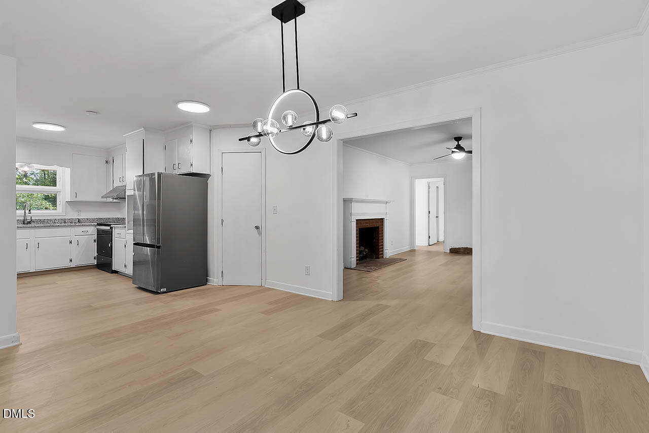 3508 Old US 1 Highway New Hill, NC 27562 - Photo 7 of 23 a view of a kitchen with a sink and stainless steel appliances