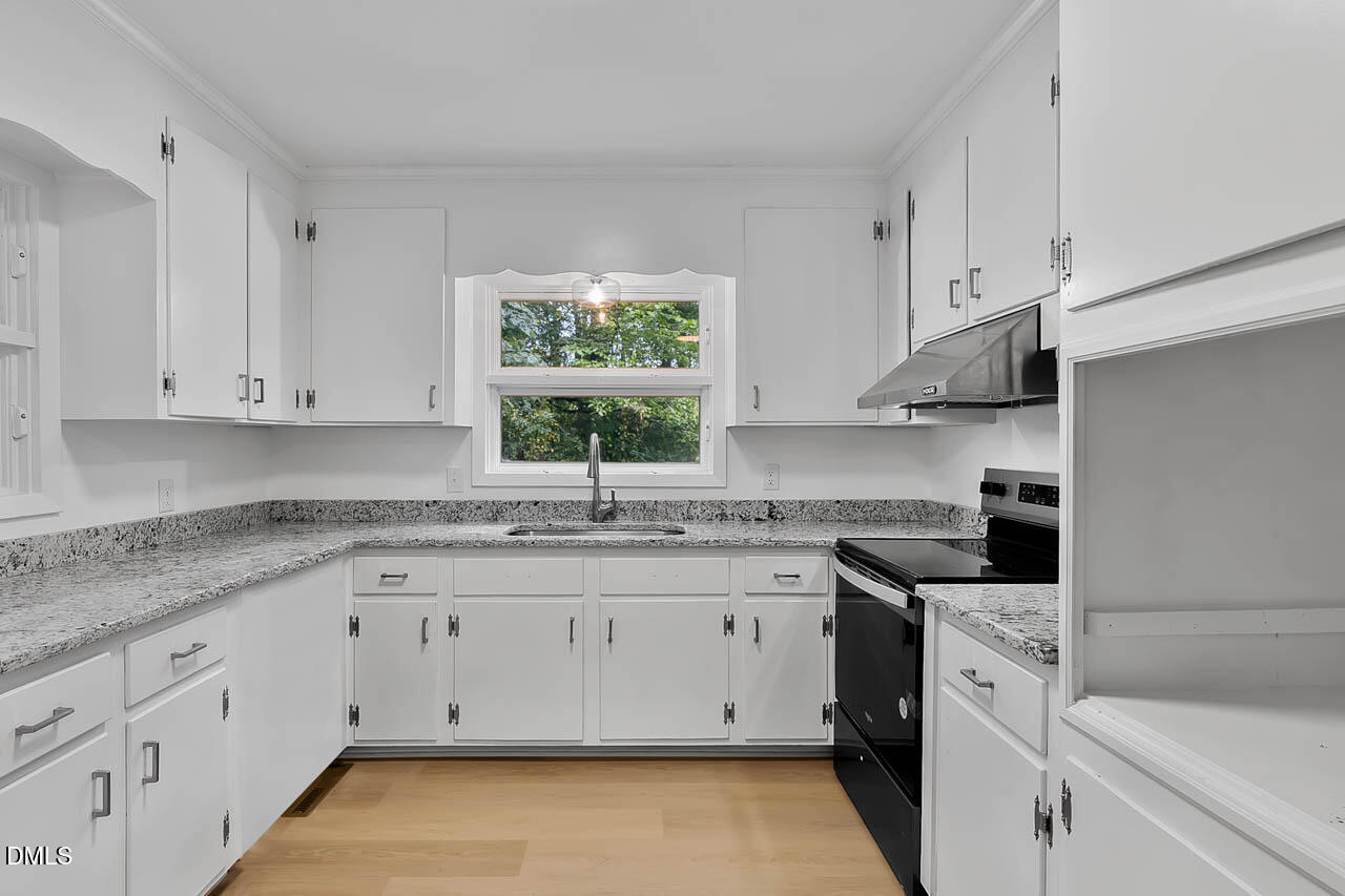 3508 Old US 1 Highway New Hill, NC 27562 - Photo 9 of 23 a kitchen with appliances cabinets and a sink