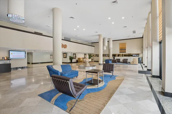 a view of a kitchen with dining room and wooden floor