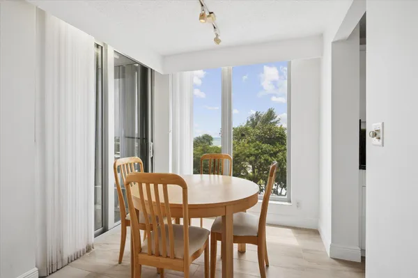 a view of a dining room with furniture window and outside view