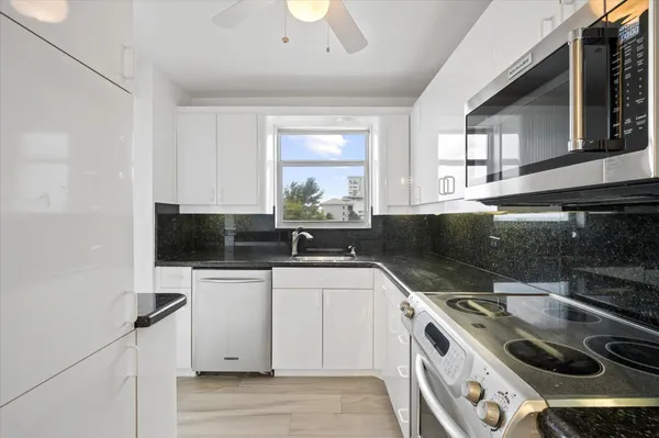 a kitchen with a stove and a sink
