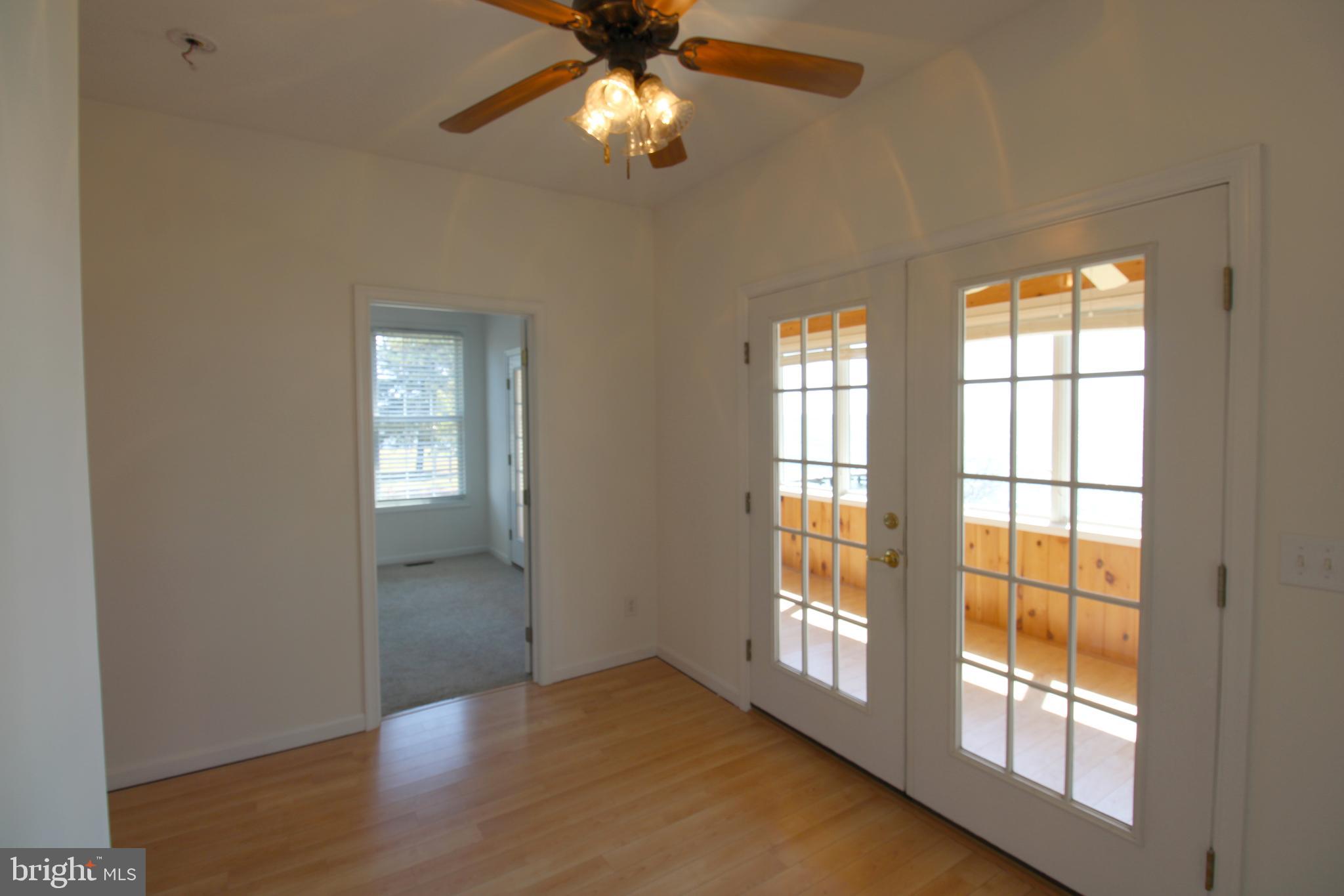 40461 Old Breton Beach Road Leonardtown, MD 20650 - Photo 12 of 61 wooden floor in an empty room with a window