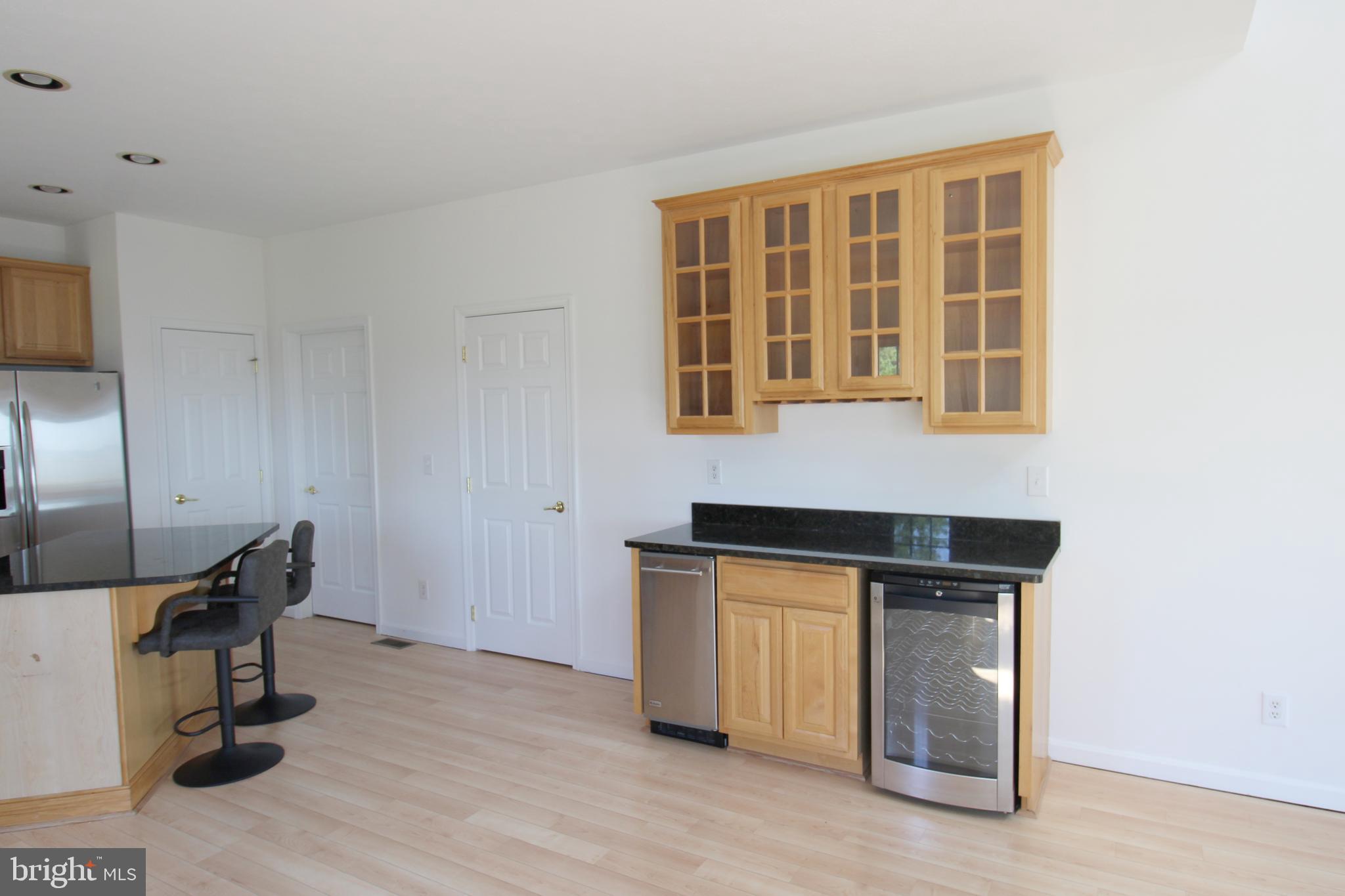 40461 Old Breton Beach Road Leonardtown, MD 20650 - Photo 19 of 61 a kitchen with stainless steel appliances granite countertop a stove and a sink