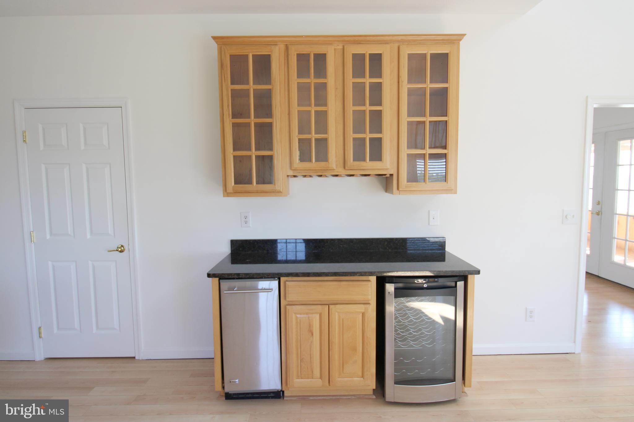 40461 Old Breton Beach Road Leonardtown, MD 20650 - Photo 20 of 61 a kitchen with a stove and a cabinet