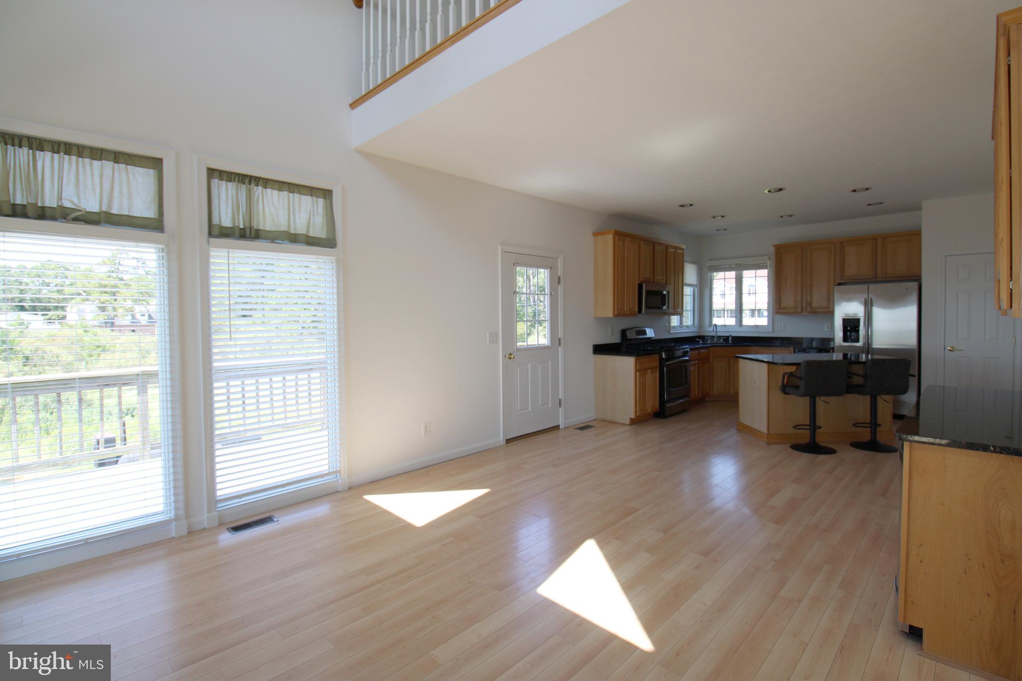40461 Old Breton Beach Road Leonardtown, MD 20650 - Photo 24 of 61 a view of kitchen with wooden floor and a window