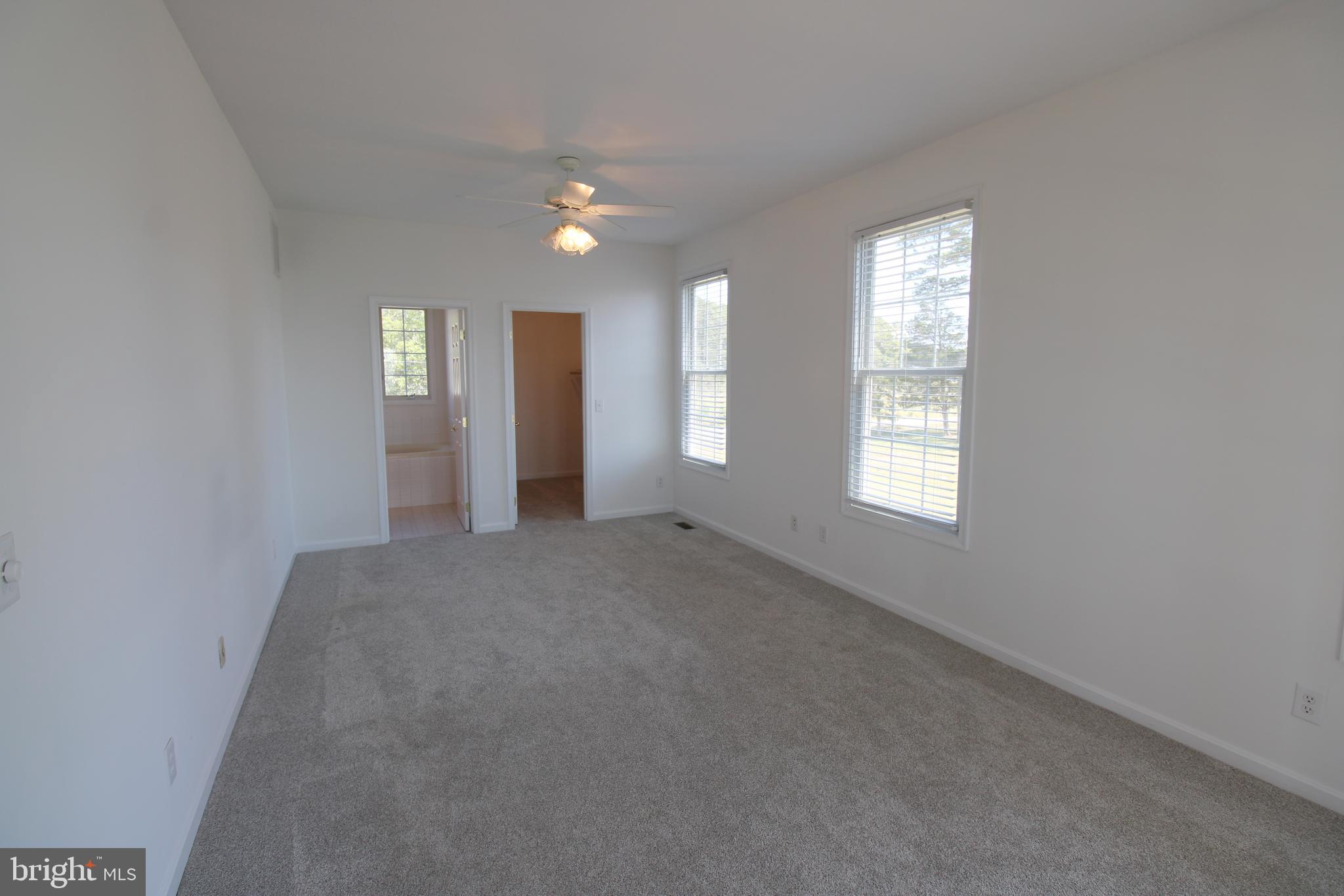 40461 Old Breton Beach Road Leonardtown, MD 20650 - Photo 32 of 61 an empty room with windows and closet