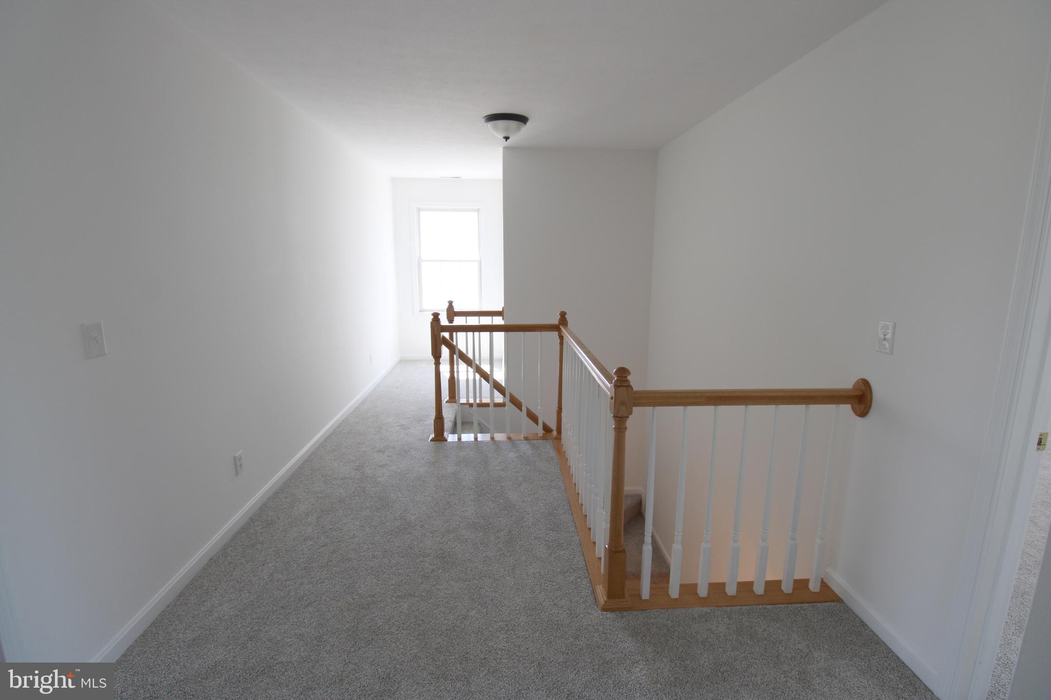 40461 Old Breton Beach Road Leonardtown, MD 20650 - Photo 38 of 61 a view of a hallway with staircase