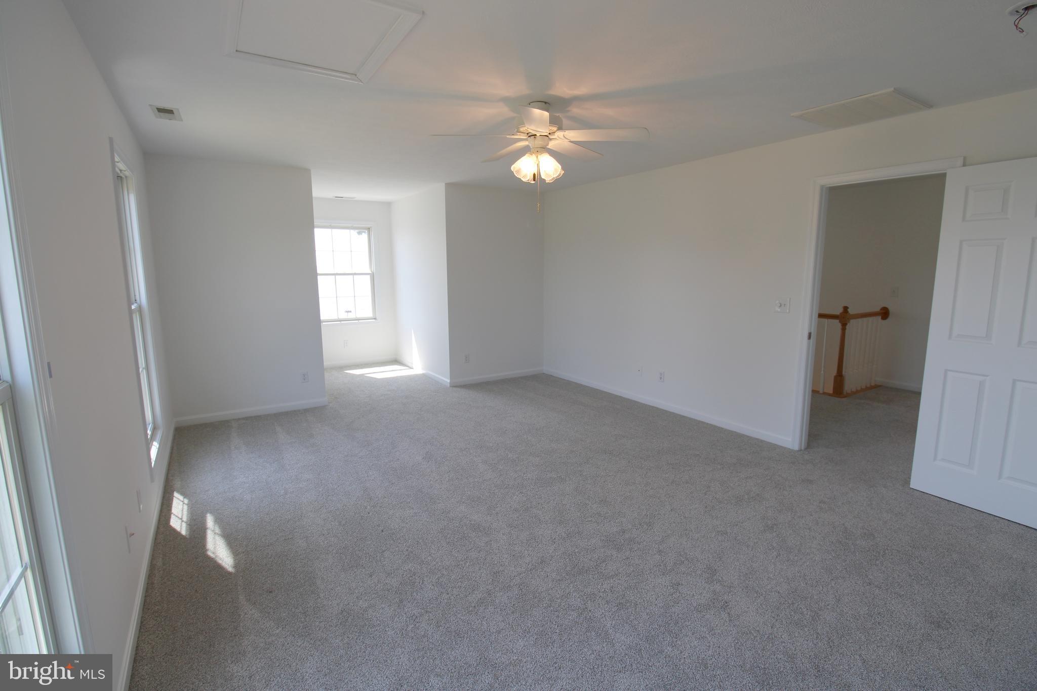 40461 Old Breton Beach Road Leonardtown, MD 20650 - Photo 43 of 61 a view of a livingroom with a ceiling fan and window