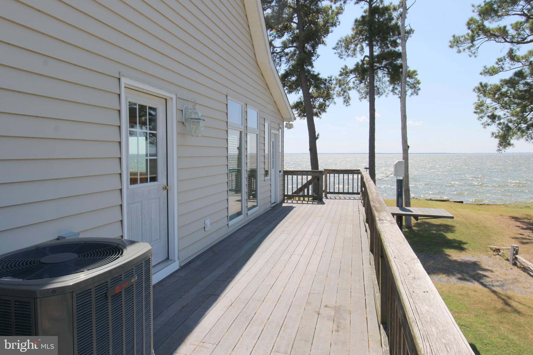 40461 Old Breton Beach Road Leonardtown, MD 20650 - Photo 5 of 61 a view of balcony with wooden floor and fence