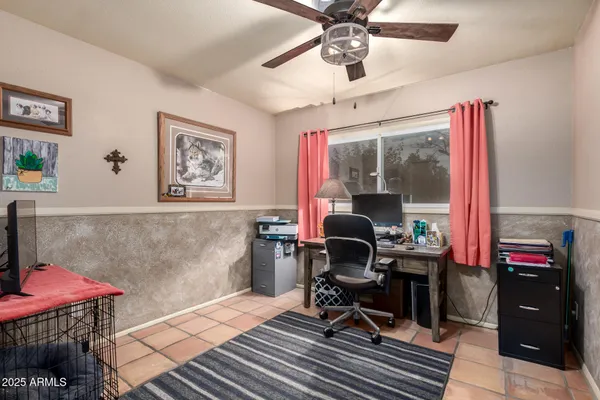 a work room with furniture and wooden floor
