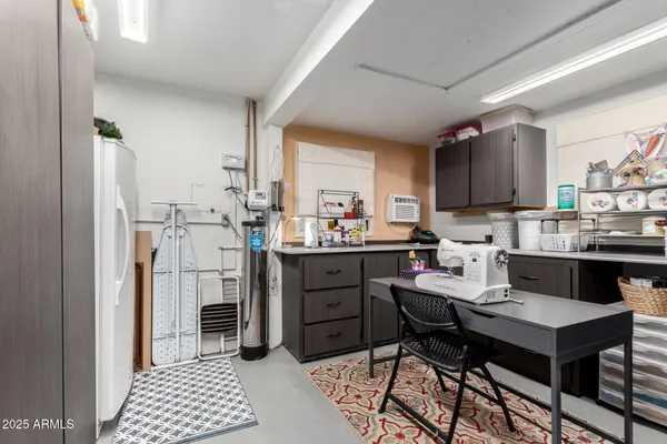 a kitchen with a sink appliances and cabinets
