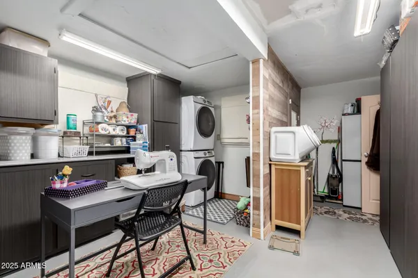 a dining room with furniture and a window