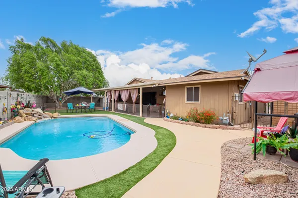 a view of a house with swimming pool