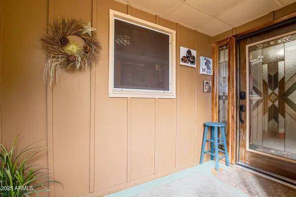 a view of a door and a window