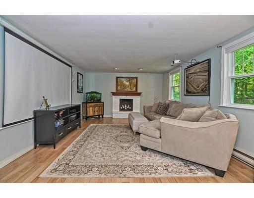 16 Smart Road Acton, MA 01720 - Photo 17 of 33 a living room with furniture and a fireplace