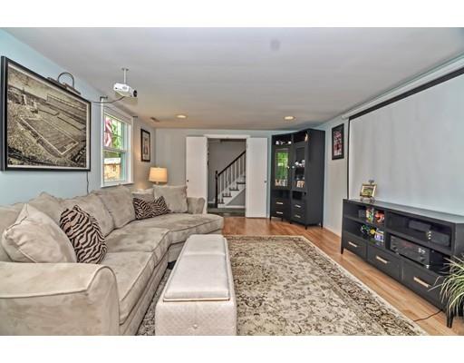 16 Smart Road Acton, MA 01720 - Photo 18 of 33 a living room with furniture and a flat screen tv