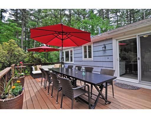 16 Smart Road Acton, MA 01720 - Photo 20 of 33 a view of a patio with table and chairs under an umbrella