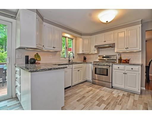 16 Smart Road Acton, MA 01720 - Photo 3 of 33 a kitchen with granite countertop white cabinets and white appliances