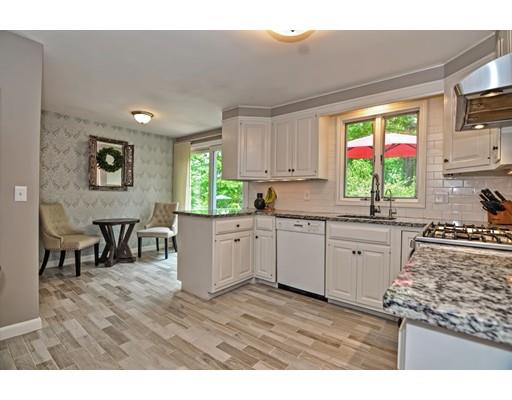16 Smart Road Acton, MA 01720 - Photo 4 of 33 a kitchen with stainless steel appliances granite countertop a stove a sink and a microwave