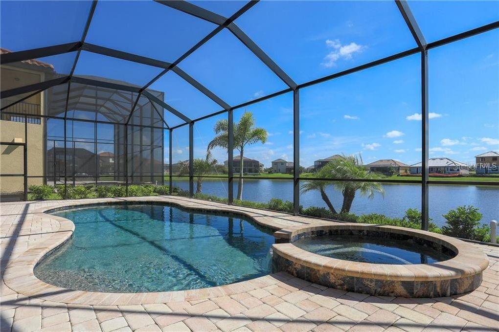 5528 Arnie Loop Lakewood Ranch, FL 34211 - Photo 23 of 59 a view of a swimming pool with a patio