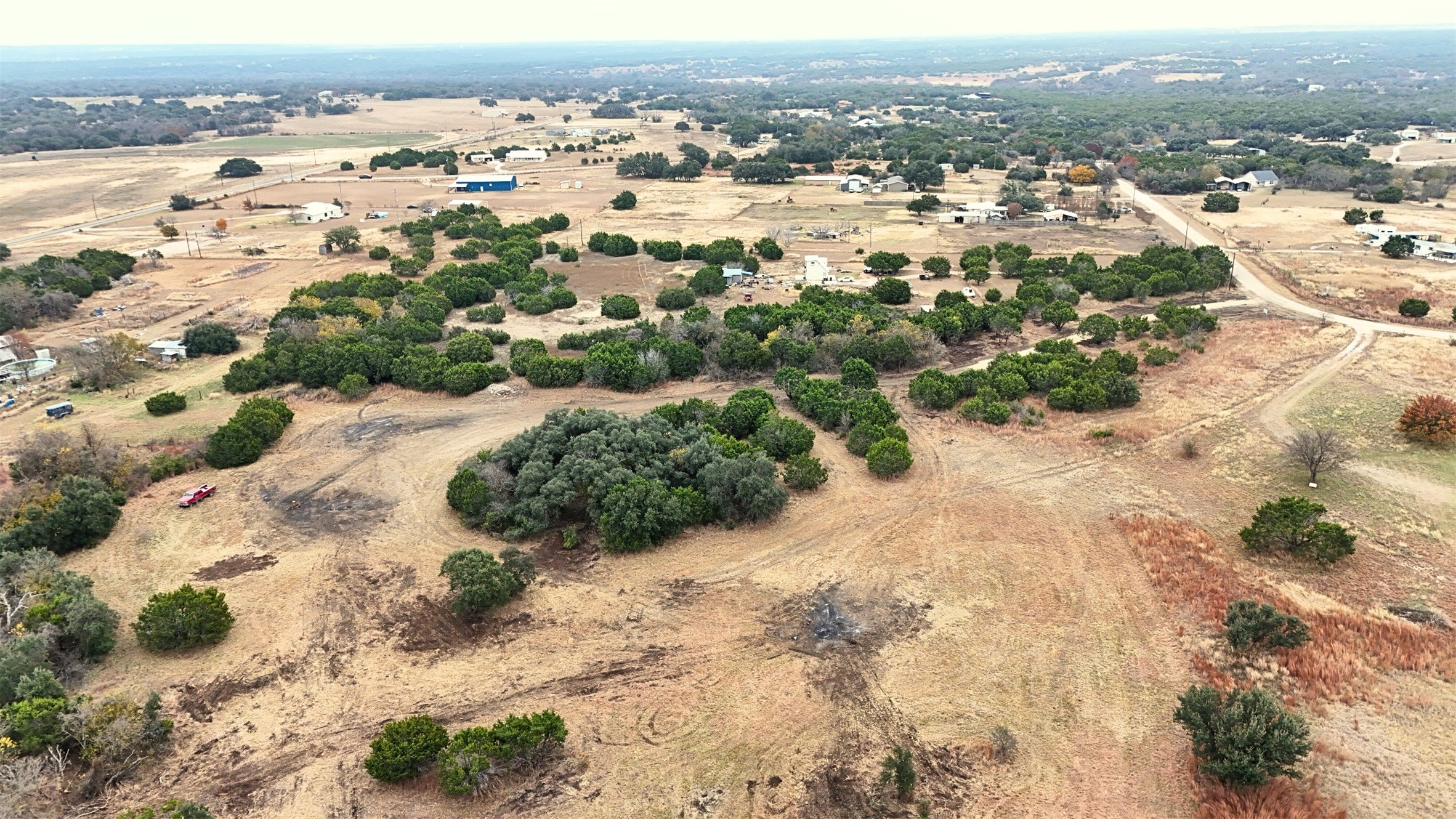 Tbd Avila Lane Briggs, TX 78608 - Photo 10 of 24 an aerial view of residential houses with outdoor space